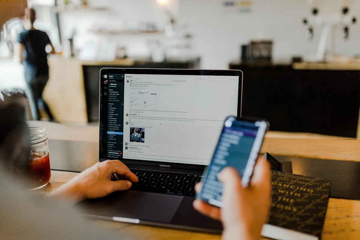 Smartphone and laptop on a desk—generic editorial metaphor for account sign-up and cloud storage; not Google branding or UI.