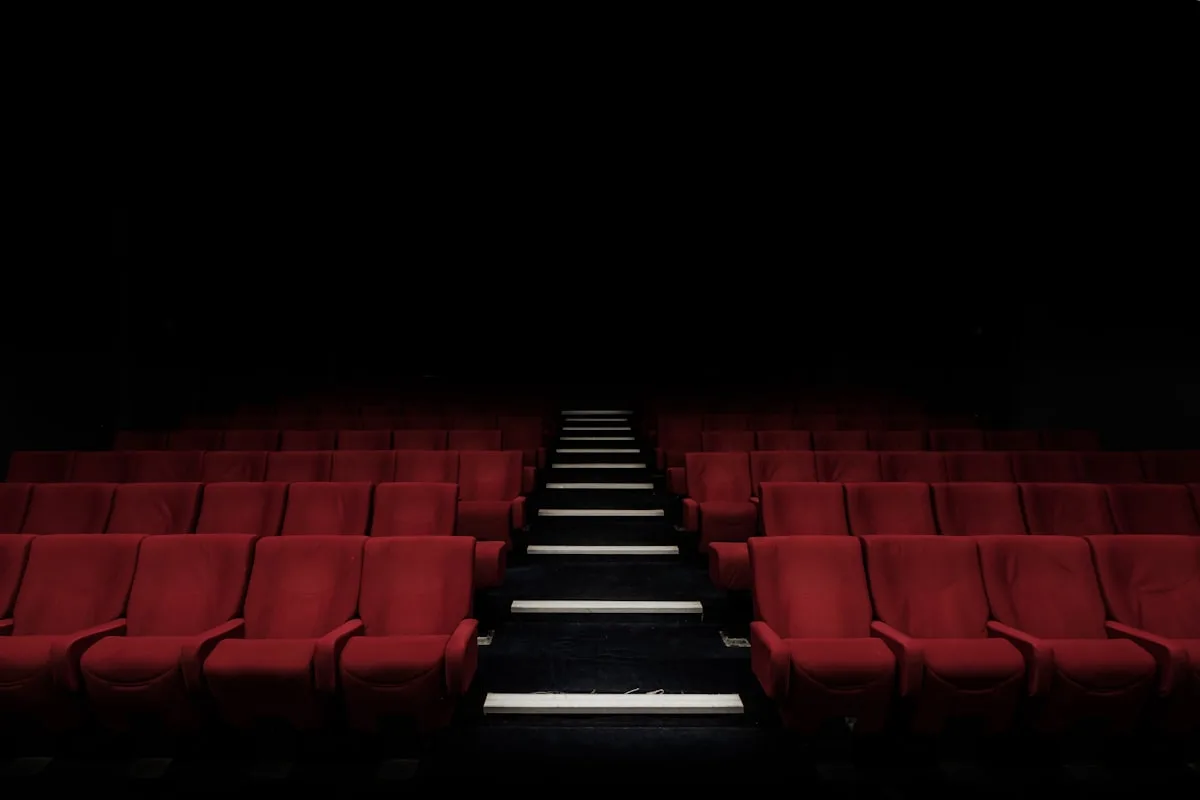 Darkened cinema auditorium with rows of seats—editorial context for a theatrical wide release; not Paris Jackson, RZA, or production stills