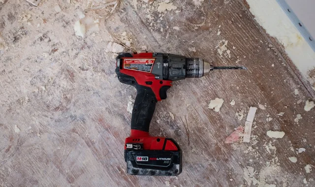 Industrial workshop tools and dust—illustrative only, not a specific UK stonemasonry site or HSE inspection.