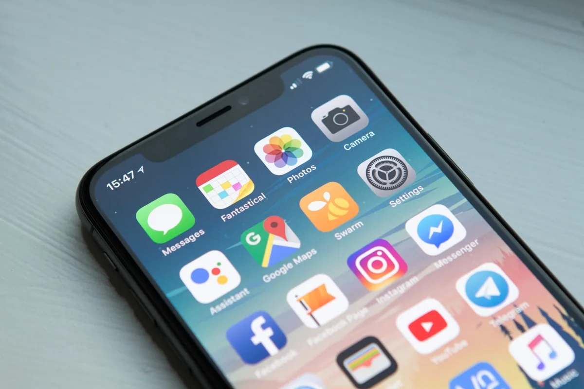 Smartphone on a desk—illustrative imagery for Newsorga’s explainer on verification badges, impersonation risk, and trust signals on social platforms.